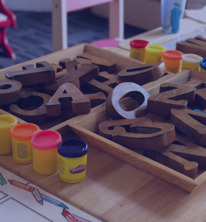 playdoh and blocks on a table in a classroom
